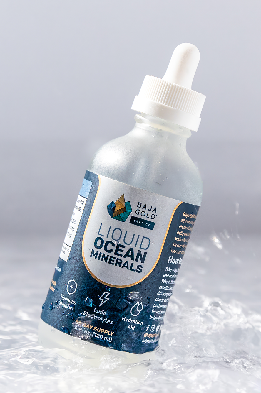 Bottle of Baja Gold liquid ocean minerals on a gray background.
